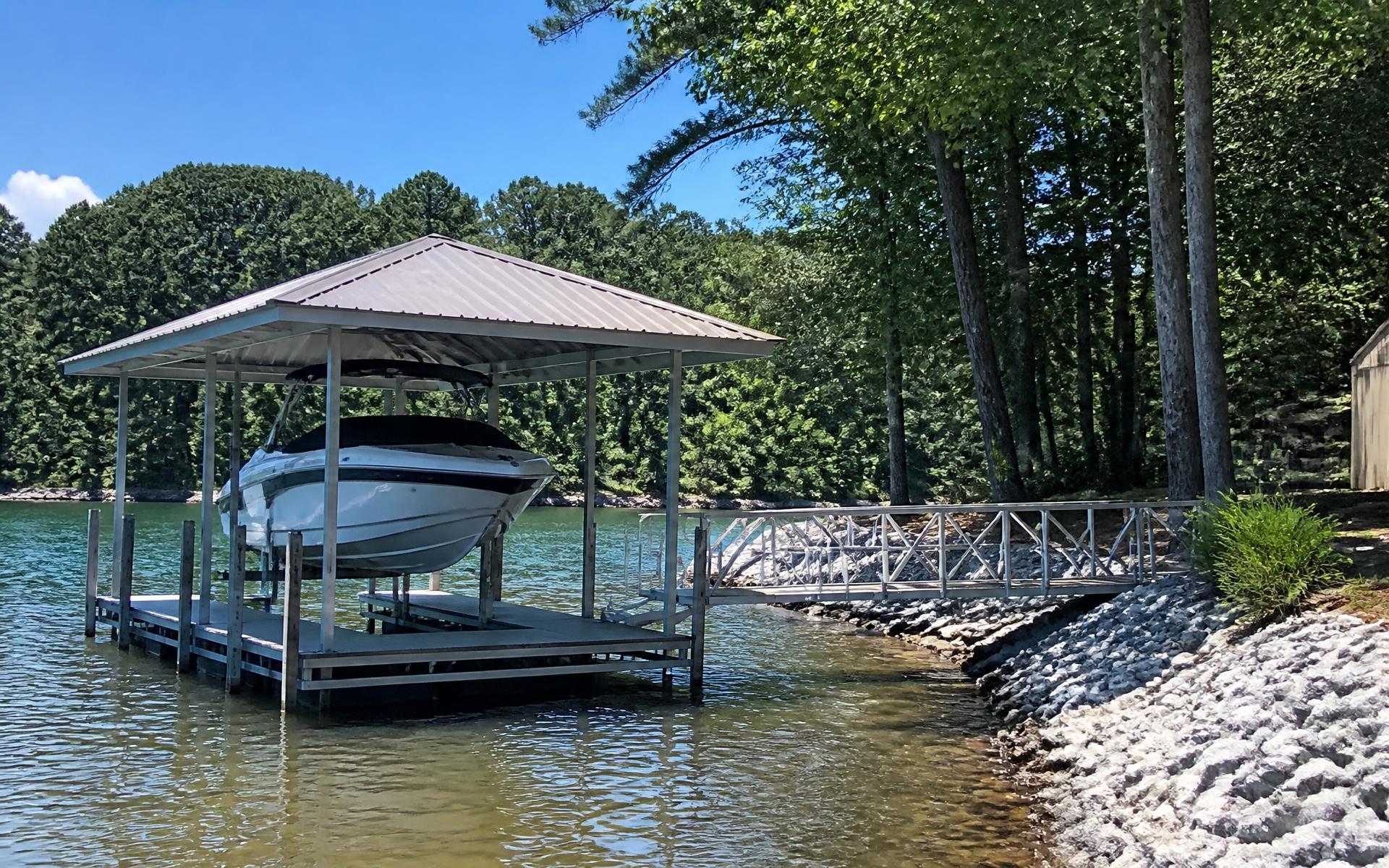 Permitted covered boat dock and boat lift on the Mountain Island Lake shoreline